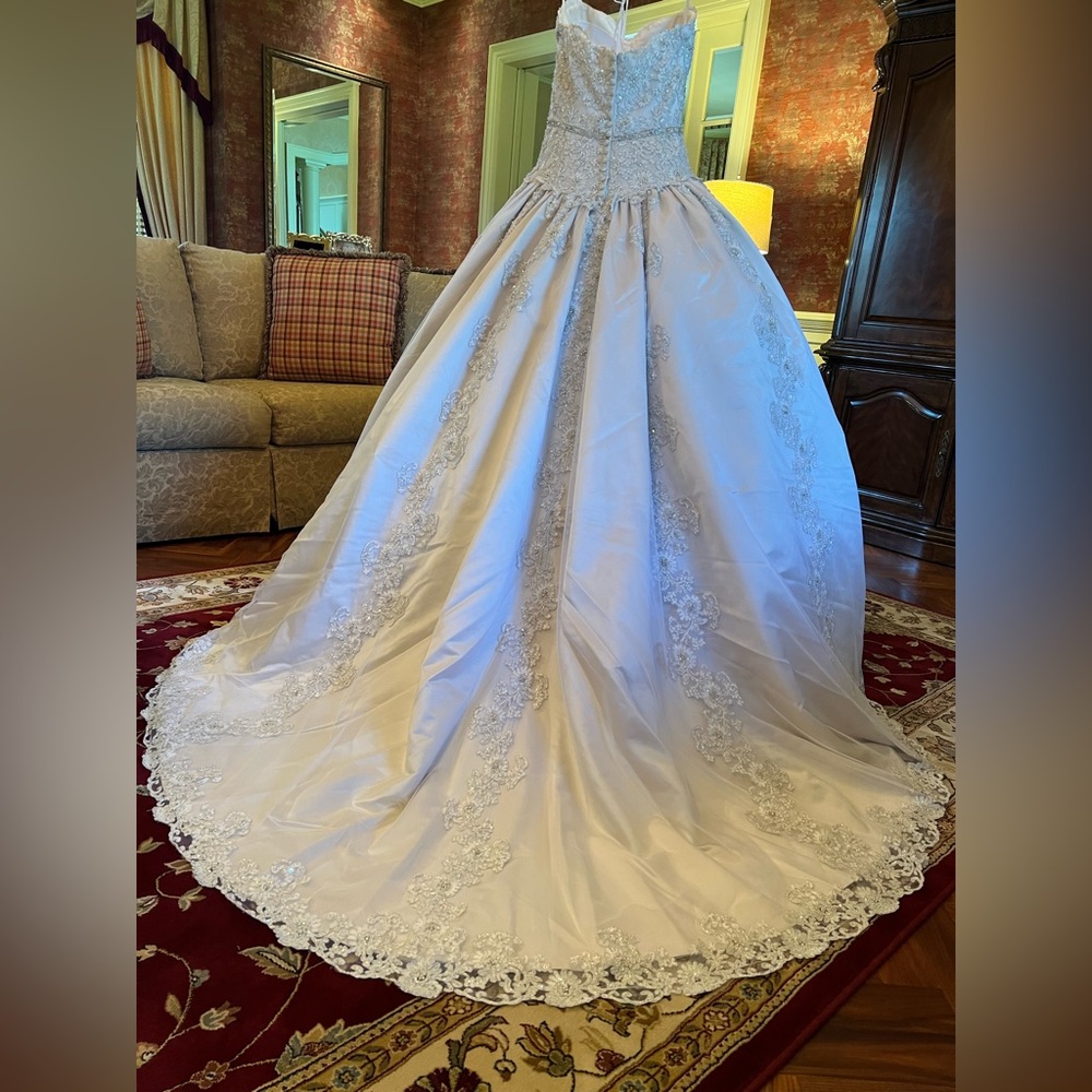 Crafted with care, this gown offers timeless elegance.